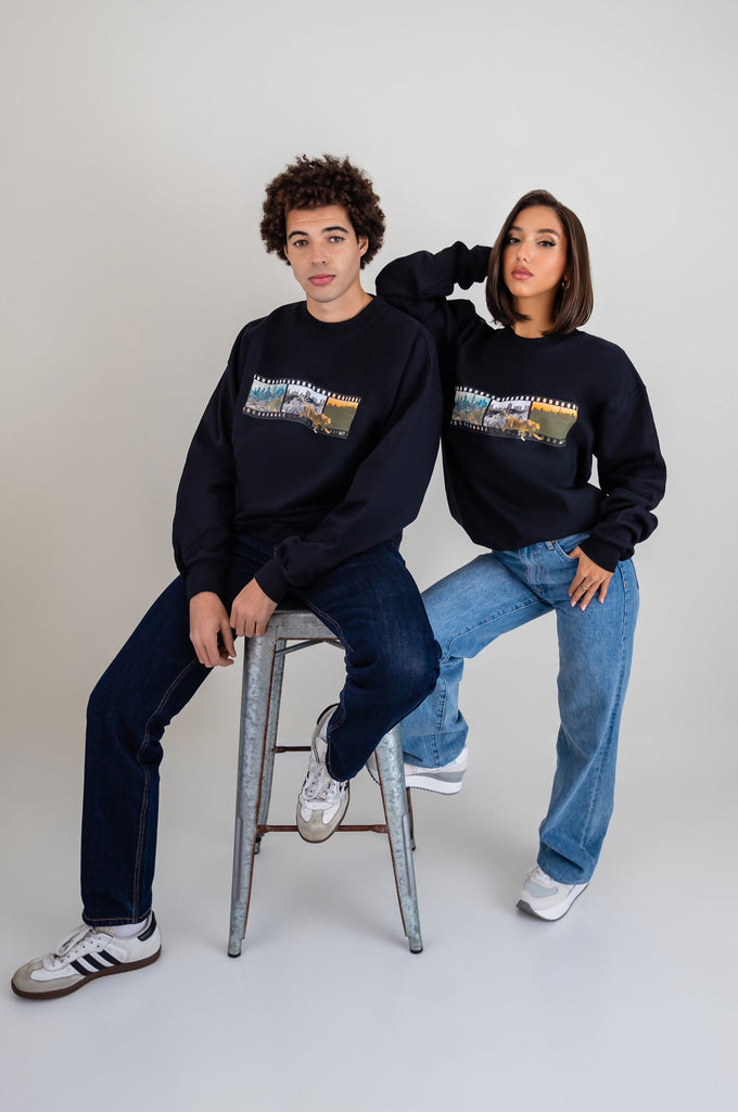 Boy And Girl Wearing Black Sweatshirts With Artwork