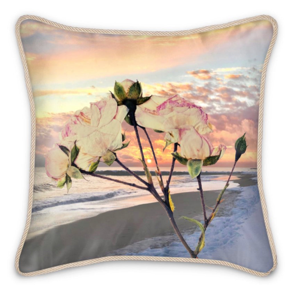 Silk Pillow With A Flower In Front Of Sunset On The Beach