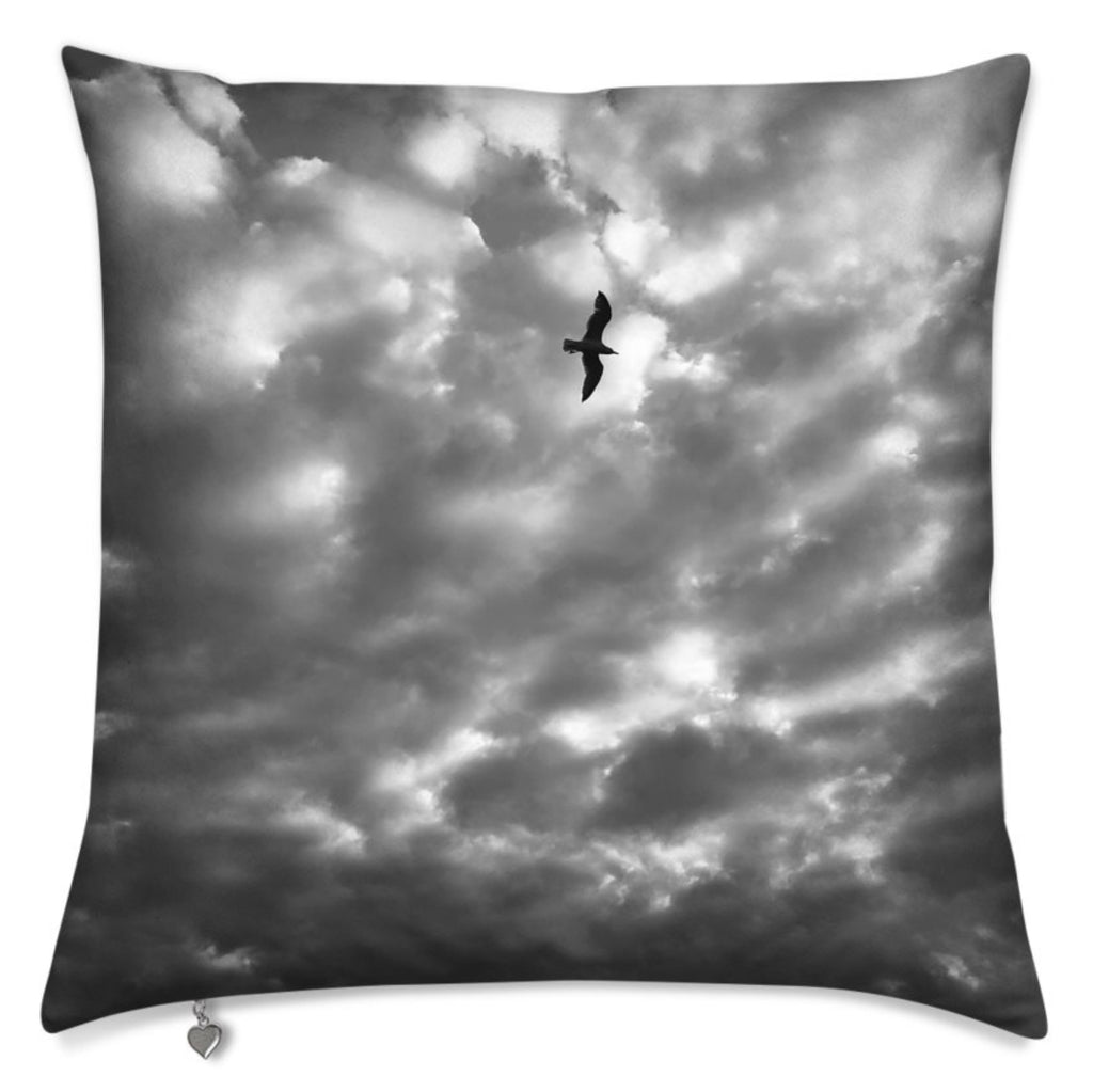 Velvet Pillow With A Bird Flying In Black And White Clouds