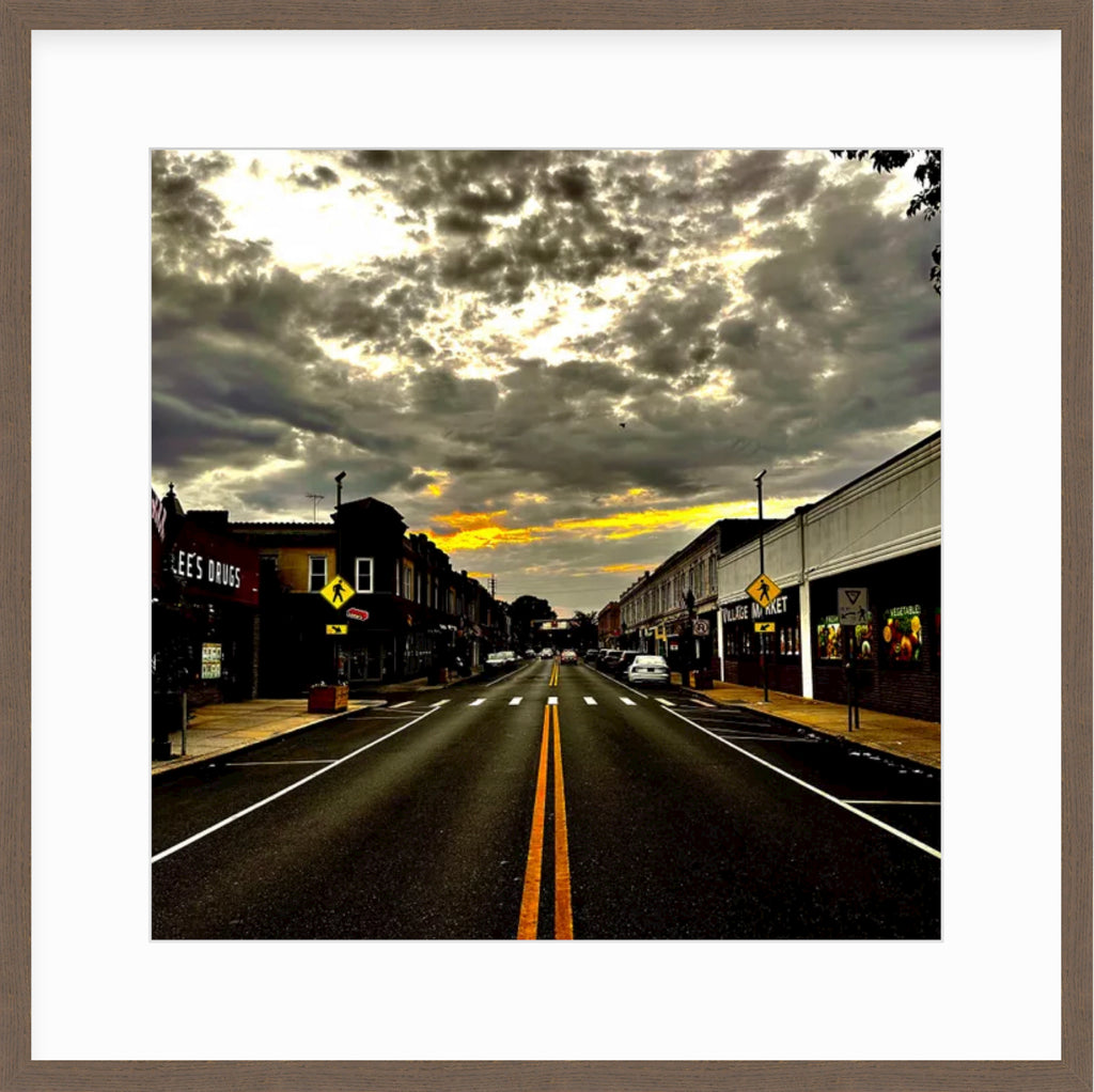 Framed Picture Of An Orange Sunset Above A Main Street Small Town
