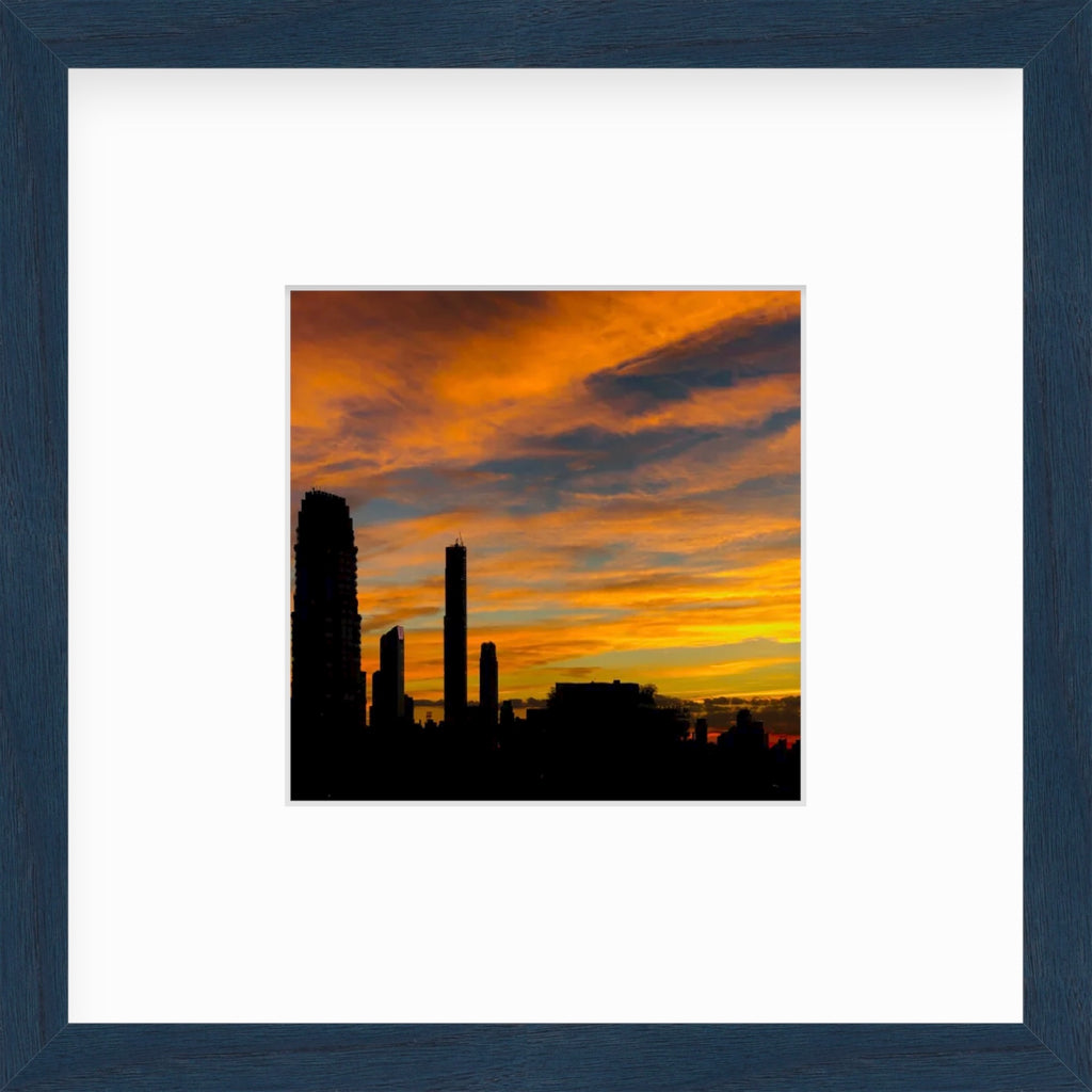 Framed Picture Of An Orange Sunset Behind City Skape