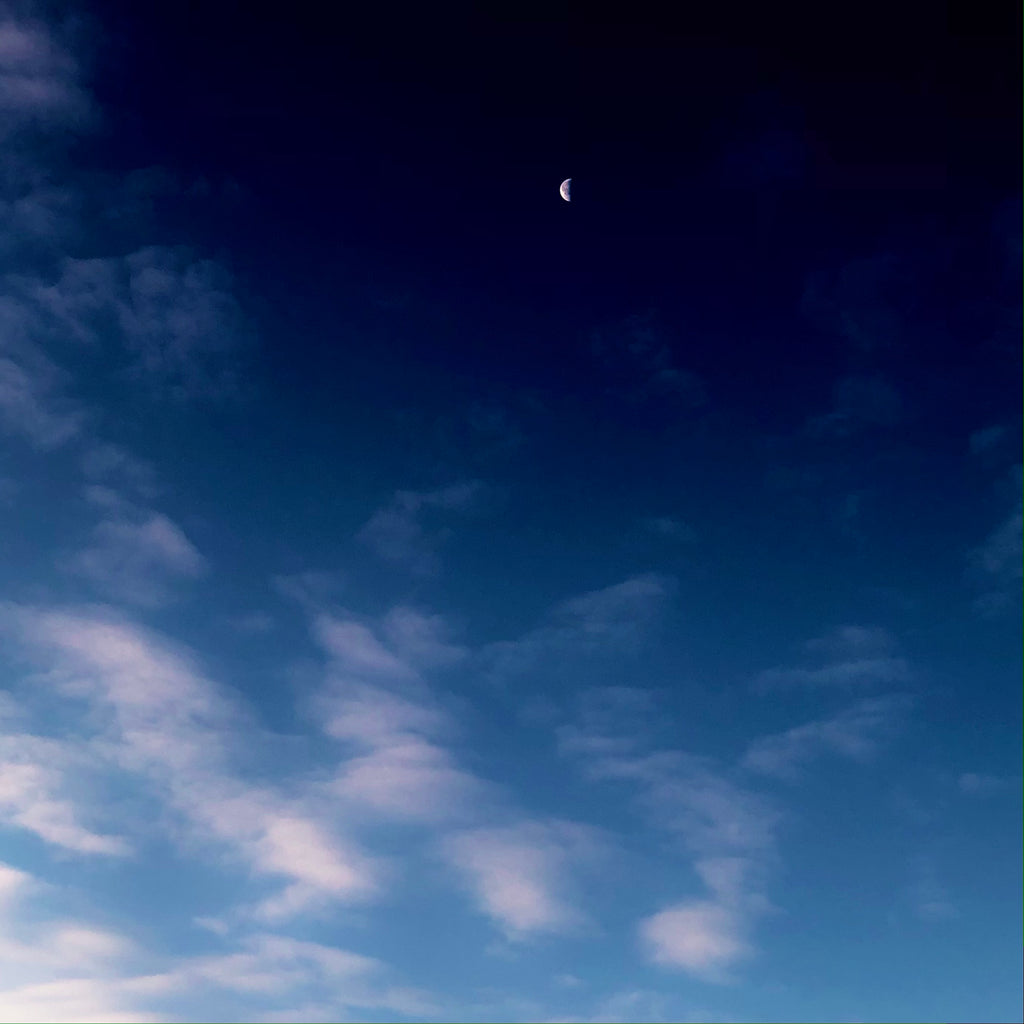 A Crescent Moon In A Deep Blue Sky
