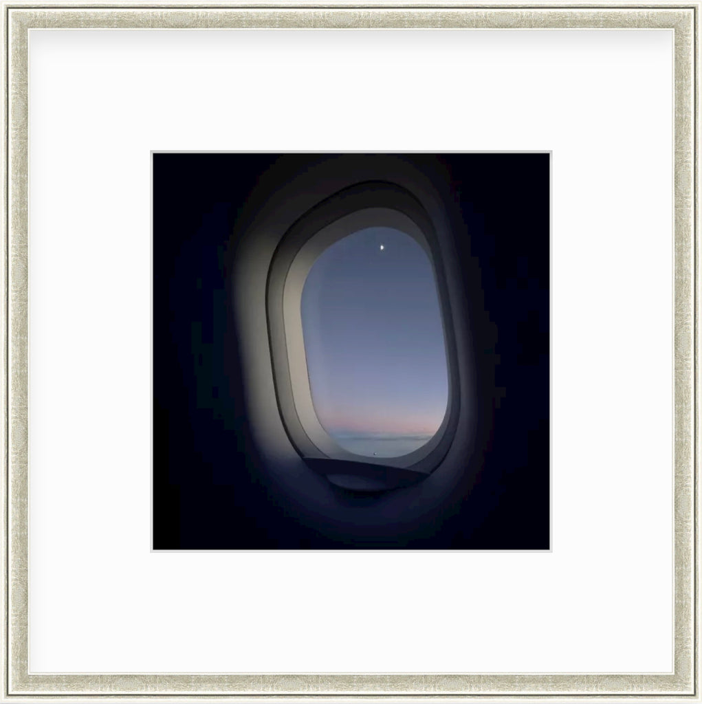 Framed Picture Of A Pink Sunset Taken Through Airplane Window