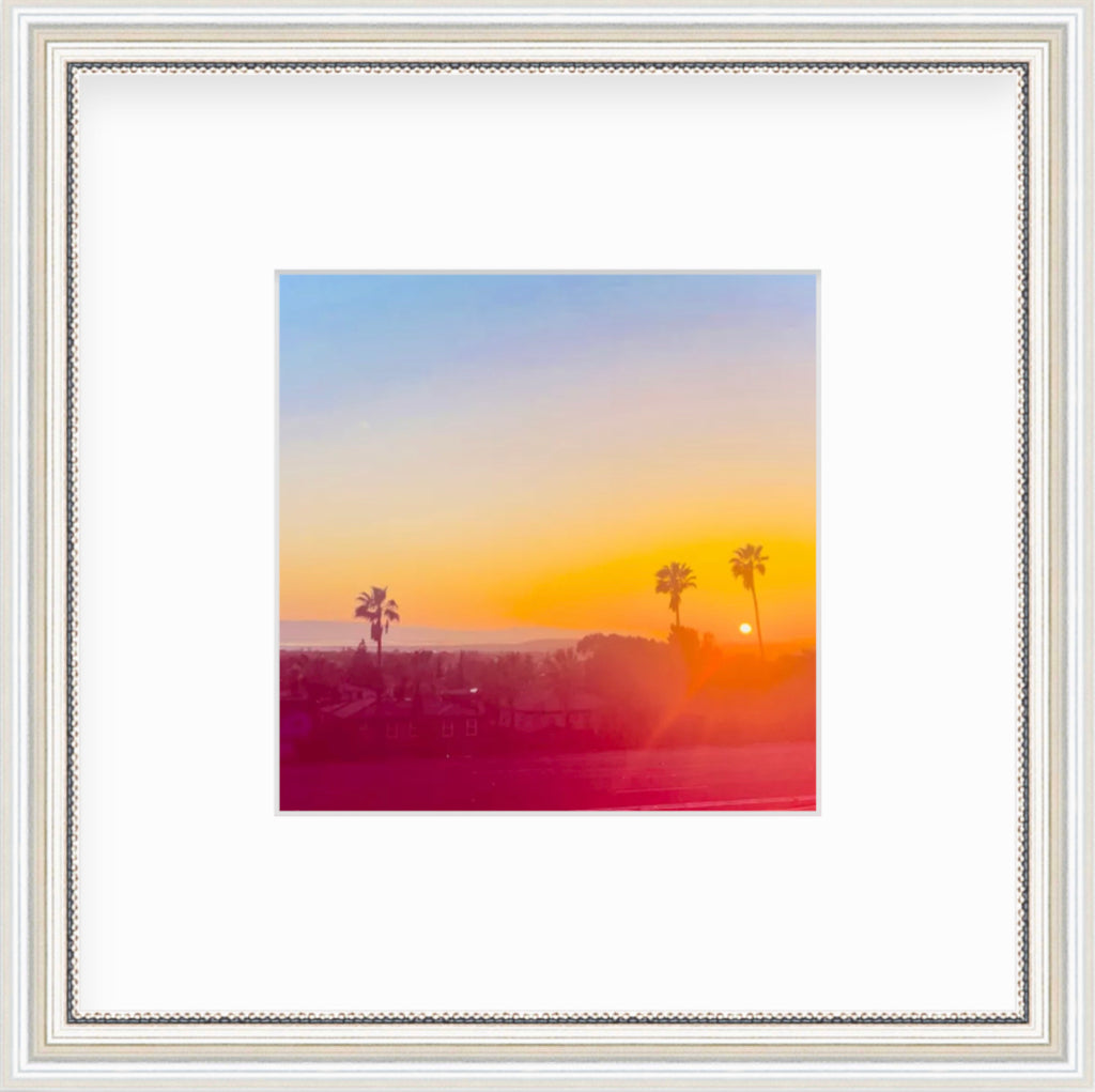 Framed Picture Of A Bright Orange And Red Sunset