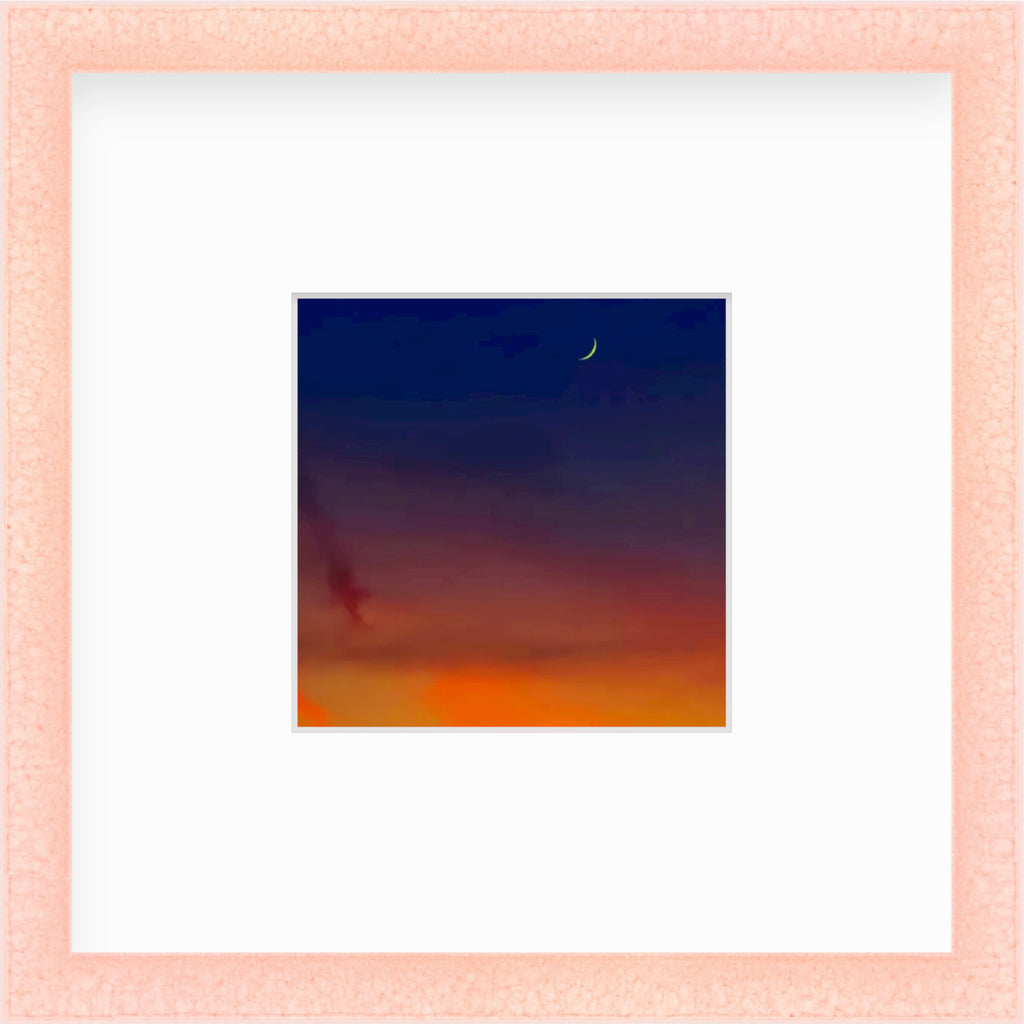 Framed Picture Of A Crescent Moon In A Dark Blue And Orange Sky