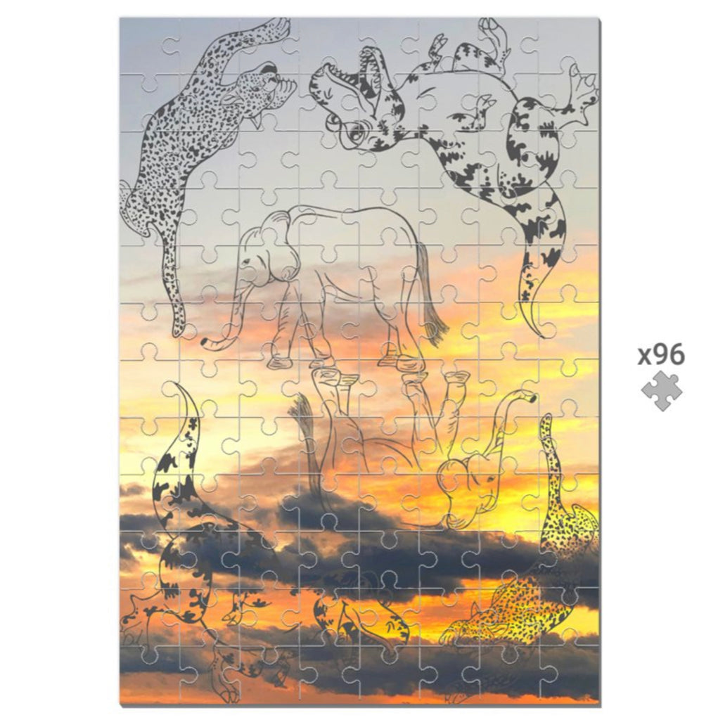 Wooden Puzzle Of Animal Outlines On Top Of Orange Sunset