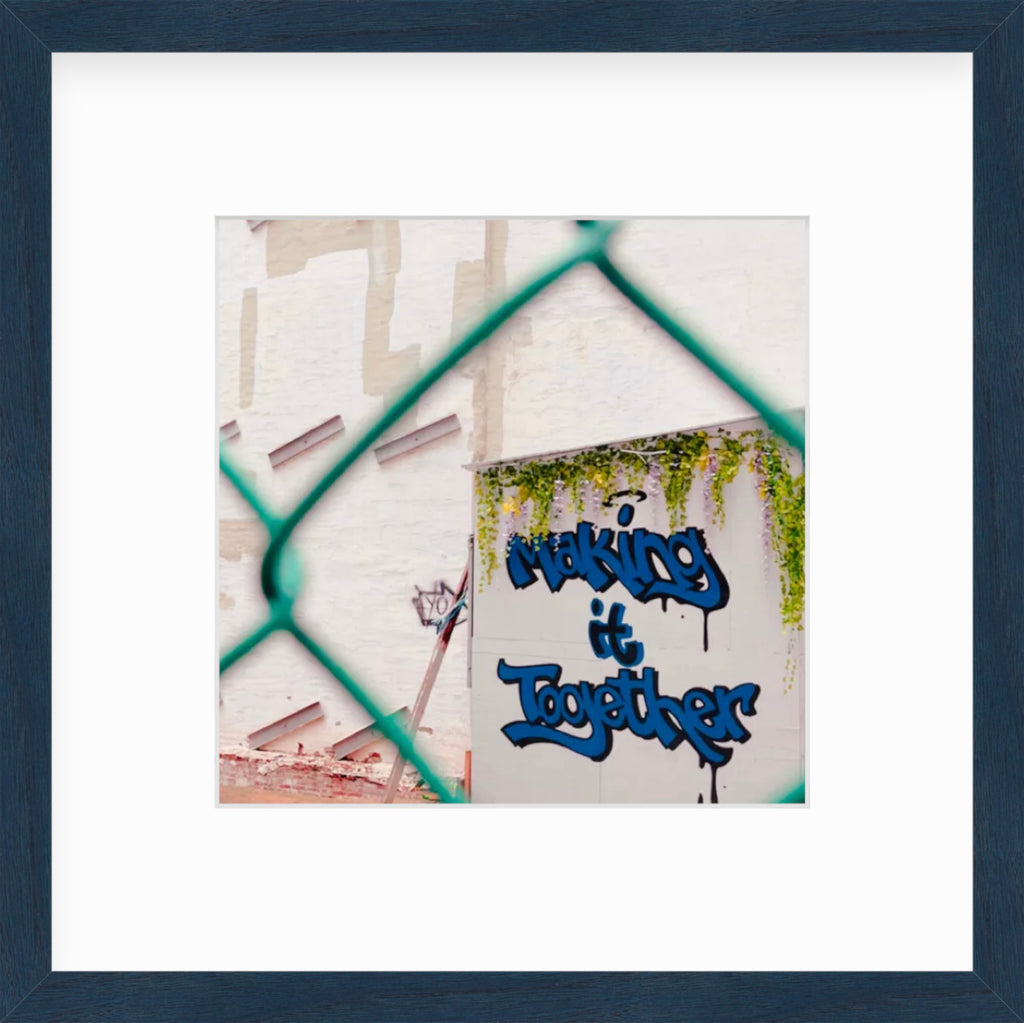 Framed Picture Of Graffiti Taken Through Chain LInk Fence
