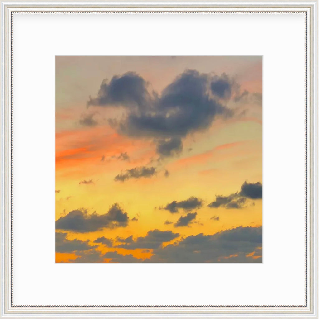 Framed Picture Of A Bright Orange And Yellow Sunset