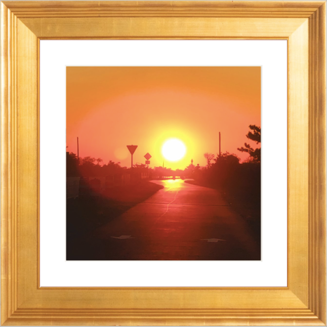 Framed Picture Of A Sunset View Over A Sidewalk